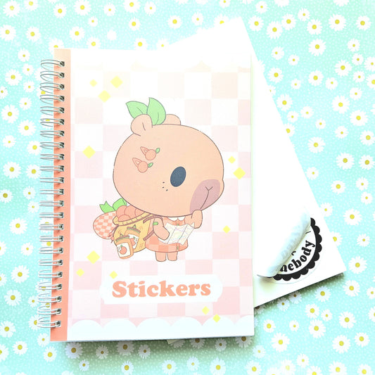 50 Page Sticker Keeper Book. Orange Capybara Reusable Sticker Album.